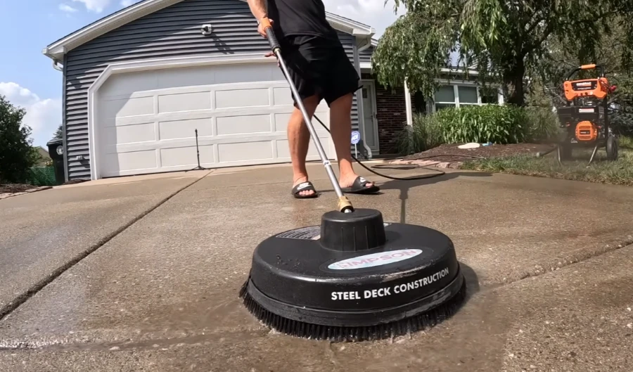 Driveway cleaning service removing oil stains and grime from concrete in Bradenton FL