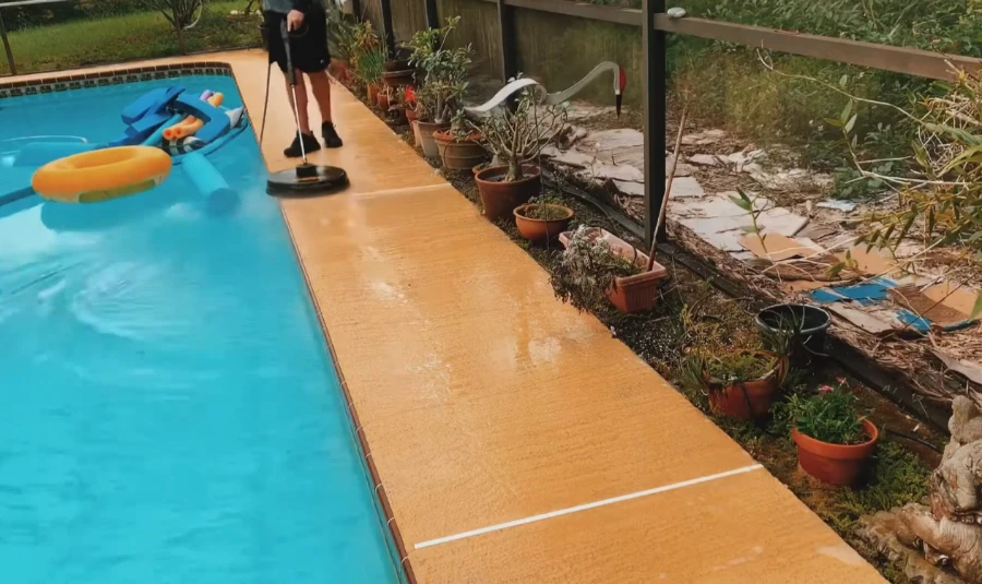 Safe low-pressure pool deck paver washing by professional technician in Bradenton FL